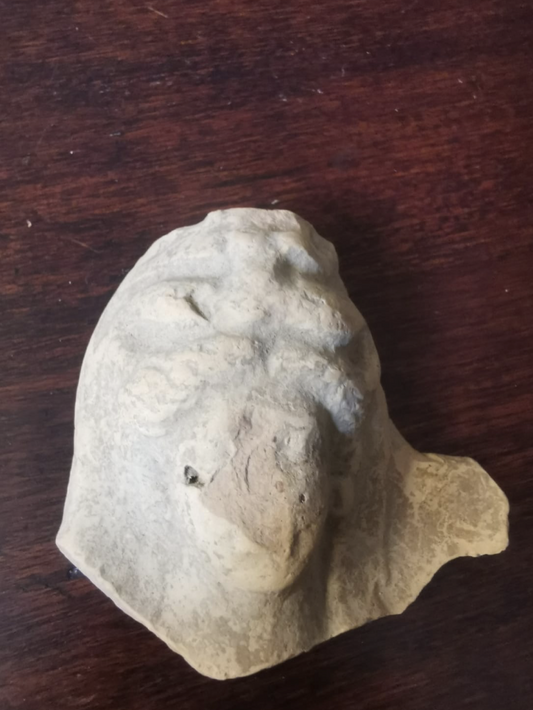 Head of Greek terracotta god figurine Demetra